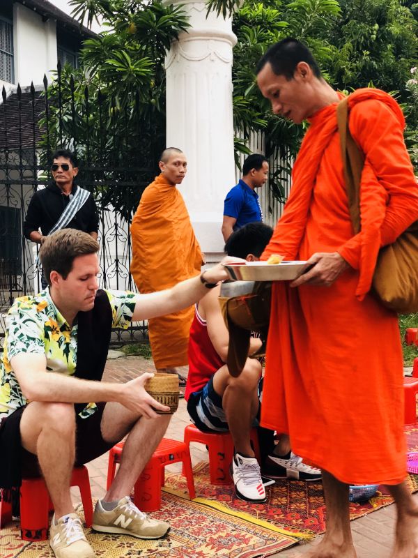 Anthony in Laos, Giving Alms to the Buddhist Monks