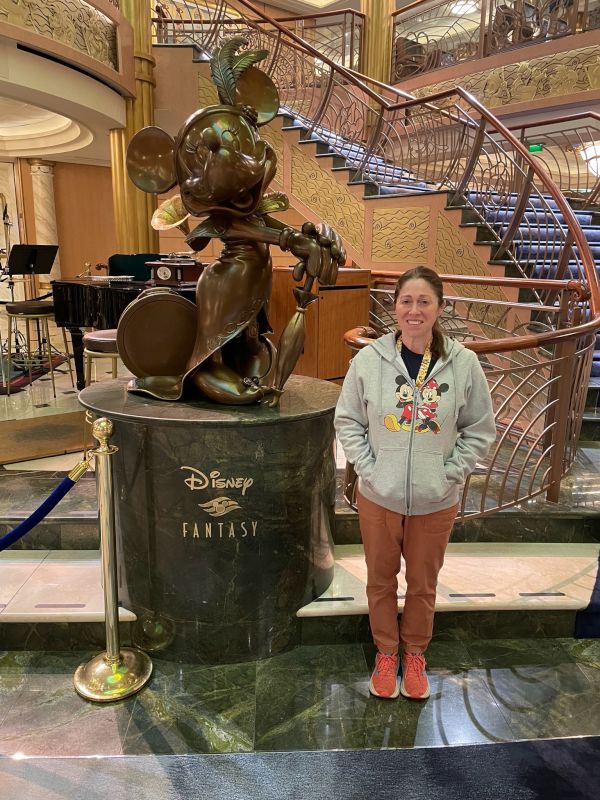 Posing with Mickey Mouse