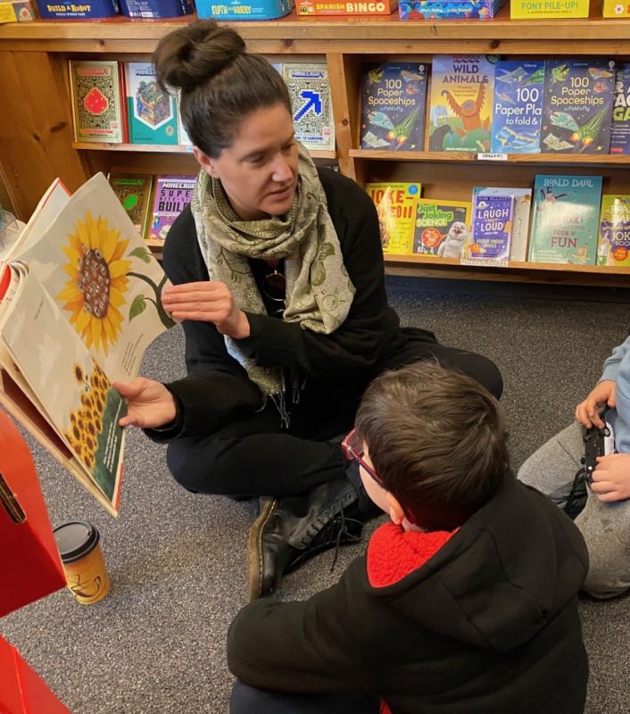 Alex Reading to Children