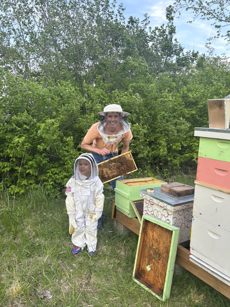 Inspecting the Hives With Our Son