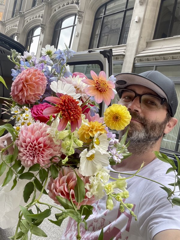 Steve Helping Jenny With a Floral Bouquet Delivery