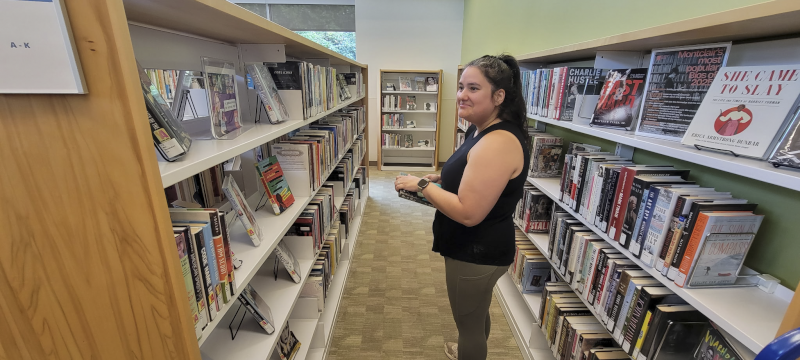 Janyce Finding Her Next Read at the Library