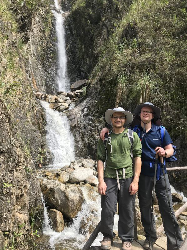 Cooling Off at a Clean and Cold Waterfall During a Hike in Peru