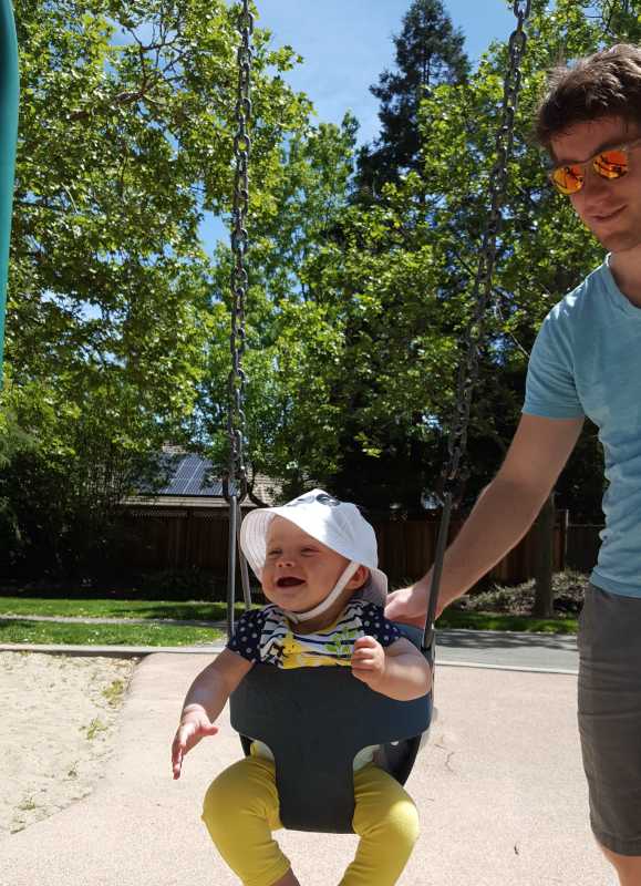 Alex Pushing One of Our Nieces on the Swing